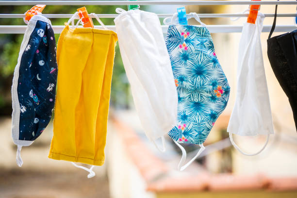 istock Face masks drying on air hang up on a leash 1267299685