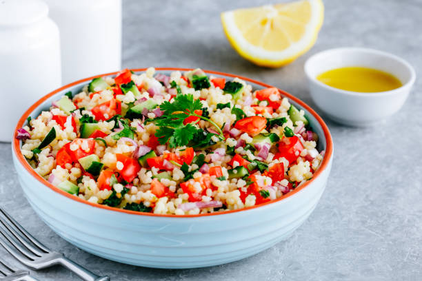 istock Couscous Tabbouleh Salad with fresh tomatoes, cucumbers and red onions 1267299800