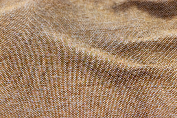 istock Brown woven fabric with wrinkles on the surface 1267301115