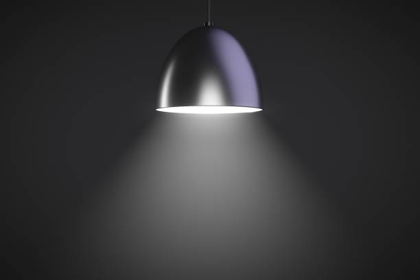 Hanging lamp glows. Dark style. Copy space