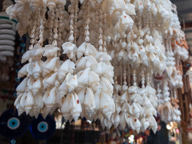 istock Traditional colorful home decorations made from different shape and color seashells. 1267305104
