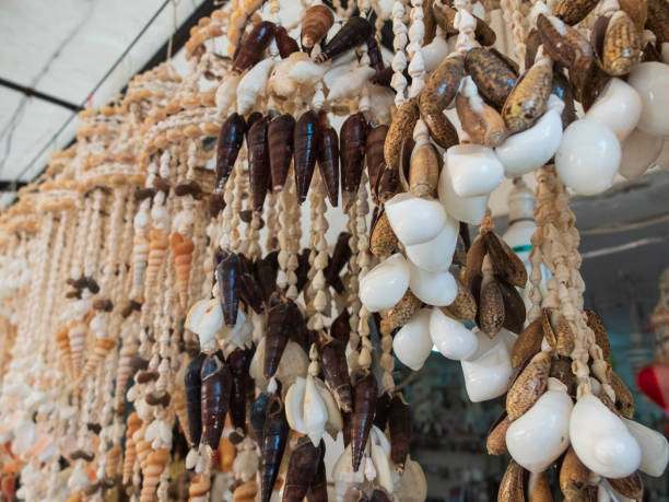 istock Traditional colorful home decorations made from different shape and color seashells. 1267305139
