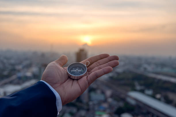 istock Businessman holding a navigation compass in hand and define marketing direction, Abstract business 1267305346
