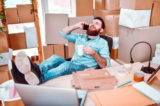 istock Office Clerk Talking On Phone, Drinking Coffee And Neglecting Job 1267306030