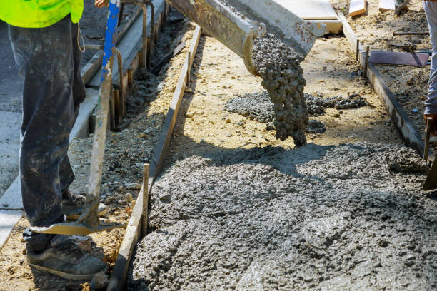 istock Construction worker pour cement for sidewalk in truck mixer pouring concrete cement for construction sidewalk 1267309136