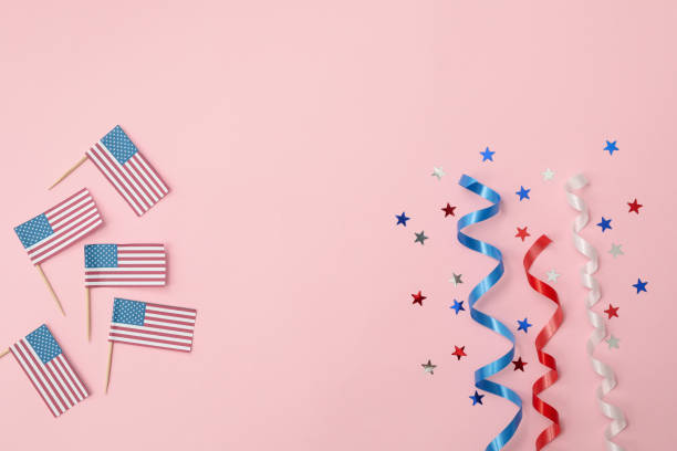 istock American flags, curly ribbons and stars on pink background 1267314349
