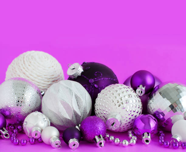 istock Christmas baubles on a purple background 1267315902