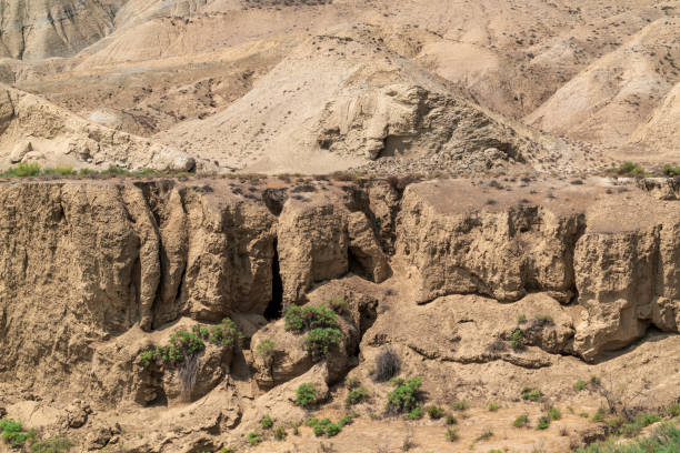 istock Steep slopes of a sandy canyon 1267316347