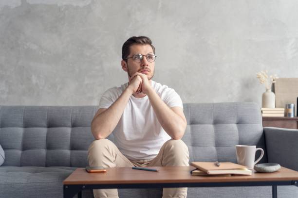 istock Thoughtful pensive handsome male student thinking about new idea or project analysing planning making decision concept 1267317725