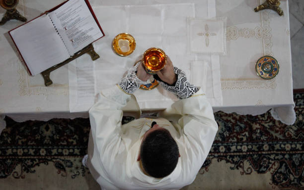 consecration on the altar. - consecrated imagens e fotografias de stock