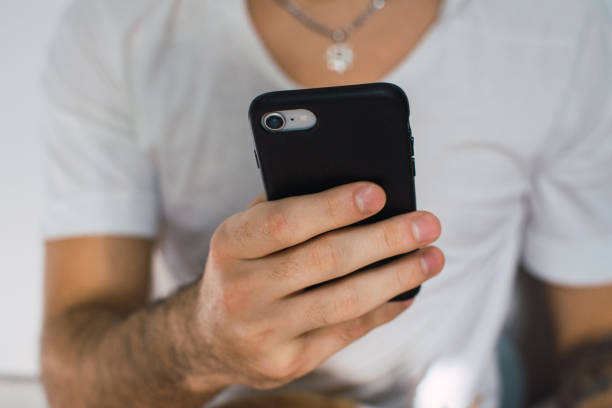 istock man using his cellphone for online dating 1267318985