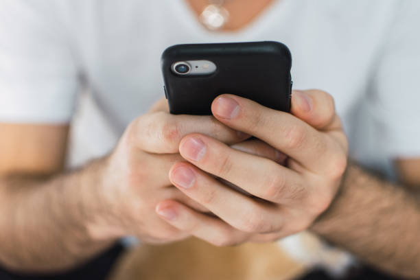 istock man using his cellphone for online dating 1267319417