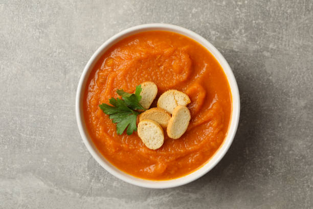 istock Bowl of pumpkin puree on gray background, top view 1267320840