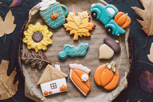 istock Hello Fall. Multicolored autumn cookies on a black background. Autumn concept 1267321312