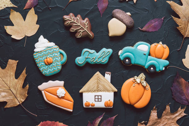 istock Hello Fall. Multicolored autumn cookies on a black background. Autumn concept 1267321314