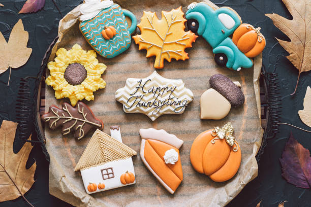 Multicolored autumn cookies on a black background. Autumn concept