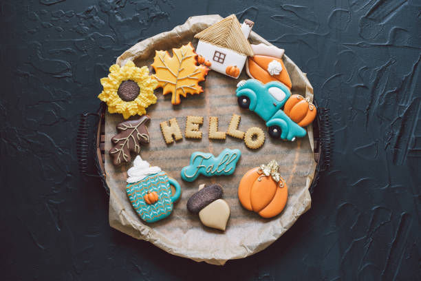 istock Hello Fall. Multicolored autumn cookies on a black background. Autumn concept 1267321830
