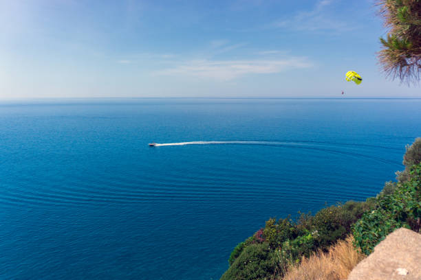Kanakli, Alanya, Turkey - May 17, 2018: Parasail flying above the turquoise Mediterranean Sea