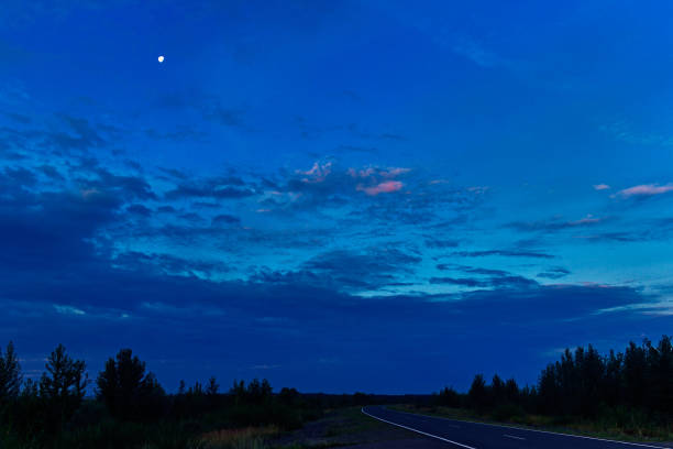 istock rural landscape with a road on a moonlit night 1267324676
