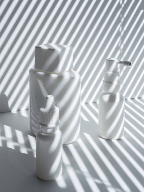istock Set of three white vials in rays of the sun 1267324801