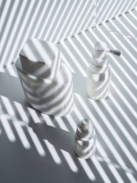 istock Composition with three white plastic and glass vials in rays of the sun 1267324811