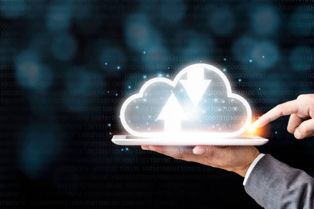 istock Businessman holding tablet with virtual cloud computer for upload and download marketing data information.Cloud technology management big data include business strategy , customer service concept. 1267325140