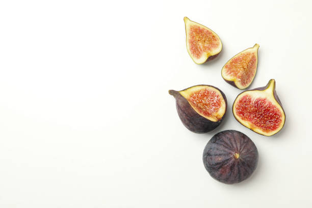 istock Fresh fig fruits and slices on white background, top view 1267325410