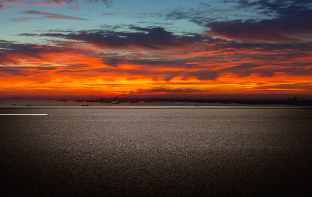 istock Evening glow, flat and wide asphalt road 1267325522