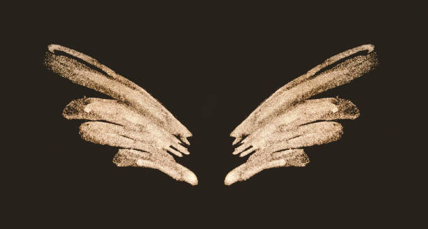 istock Abstract gold hand painted wings on black background 1267326485