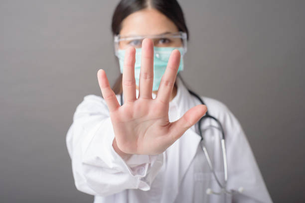 istock woman doctor is stop Coronavirus (Covid-19) 1267326607