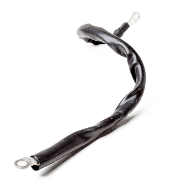 istock Thick short curved red electric wire in black rubber isolation on a white isolated background. Automotive positive terminal. Auto service industry. 1267326631