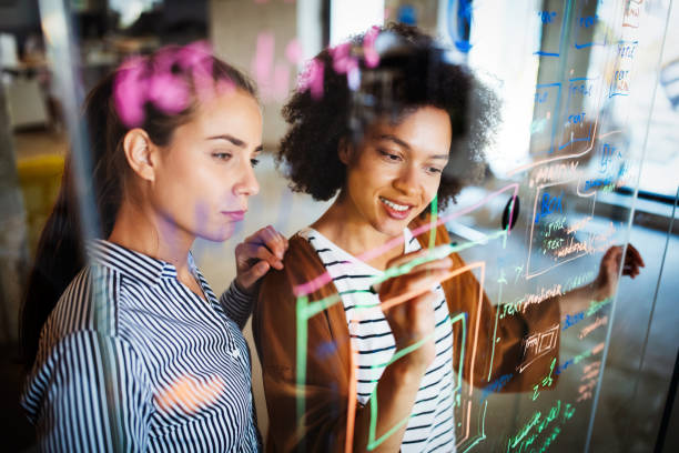 istock Collaboration and analysis by business people working in office 1267329698