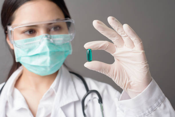 istock Intelligent Doctor is holding medicine pill 1267332032