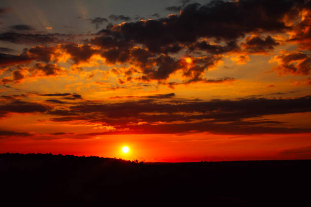 istock sunset in the valley, beautiful clouds and sun 1267333414