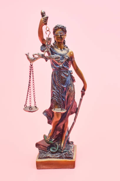 istock Bronze statue of Themis on a pastel pink background, copy space 1267337785