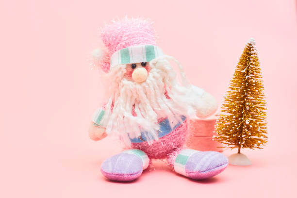 istock christmas decoration on pastel pink background, copyspace 1267337808