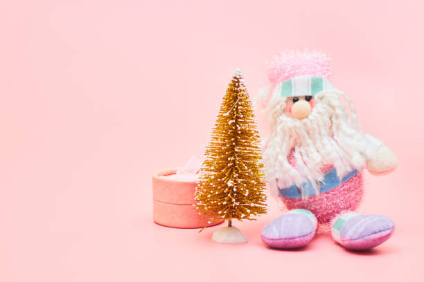 istock christmas decoration on pastel pink background, copyspace 1267337812