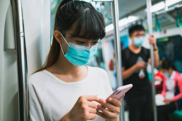 istock woman with mask in metro 1267339112