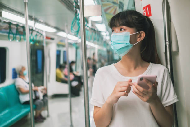 istock woman with mask in metro 1267339380