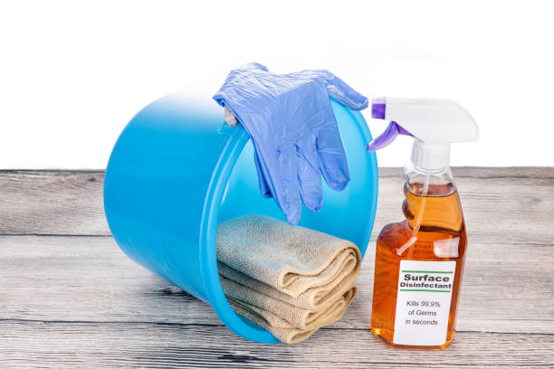 istock Surface disinfectant spray with pail, gloves and cloth. Complete sanitizing maintenance set 1267342718