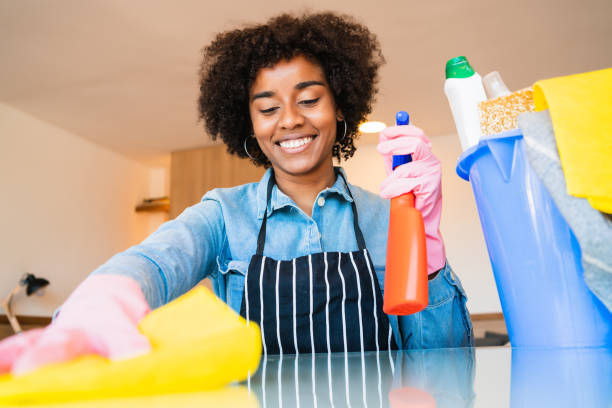 istock Afro woman cleaning new home. 1267345330
