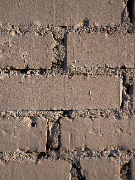 istock Texture of an old brick wall painted with brown matte paint. 1267345353