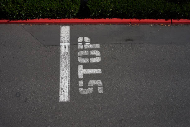 istock Painted Stop Sign with a Curb in Red 1267345572