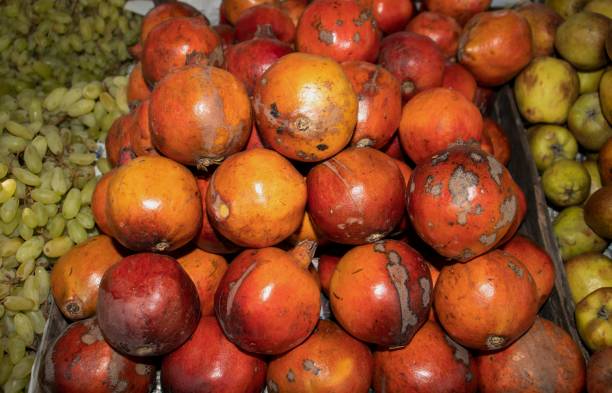 istock Pomegranate Fruit in an Indian Fruits Stall for Selling 1267345691