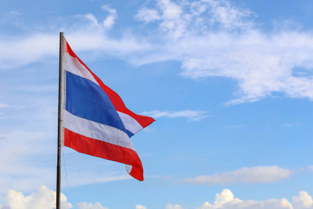 istock The thailand flag on wood pole have sky background 1267349048