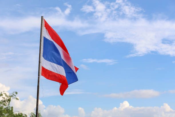 istock The thailand flag on wood pole have sky background 1267349052