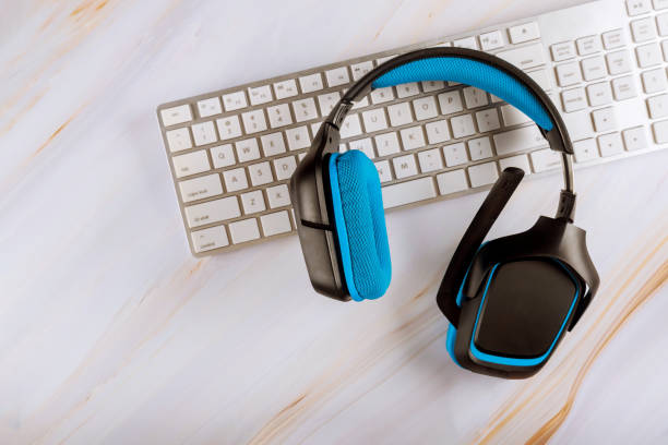 istock VOIP headset communication support, call center and customer service help desk on computer keyboard. 1267359291