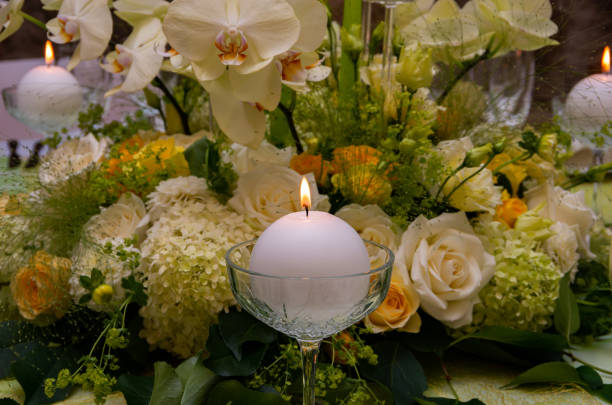 istock Decorated table with table compositions and burning candles, green 1267360037
