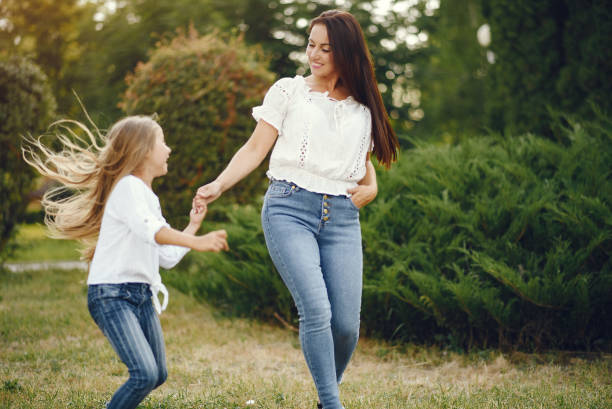 istock Mother with daughter playing in a summer paek 1267360290