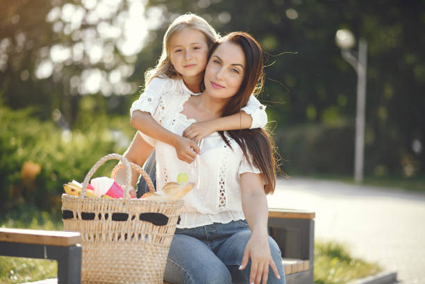 istock Mother with daughter playing in a summer paek 1267360835